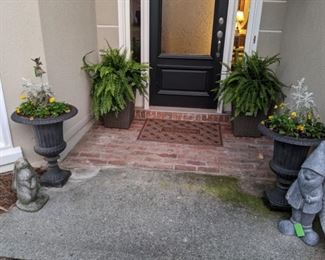Nothing says "Welcome" to a Southern home, like cast iron planters, with fresh violas, for the winter/spring season, tempered by cascading Boston ferns in all-weather wicker stands, with metal liners.  Easter's coming and who can resist a concrete bunny, or a happy gnome?  :-)