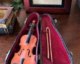 Miniature violin in case