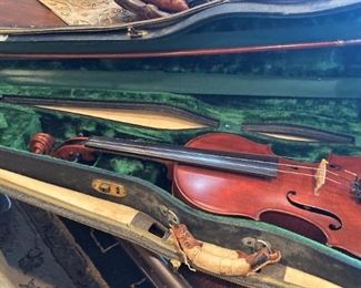 A real violin, wooden bow, and case
