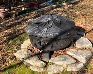 The firepit has a cover.