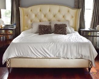 King tufted upholstered bed with nailhead trim. 