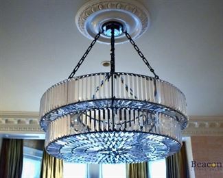 Pair of brass and crystal two-tiered chandeliers approx 36”w