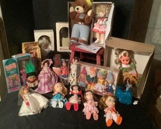 Assorted Collectible Dolls and Childs Red Chair