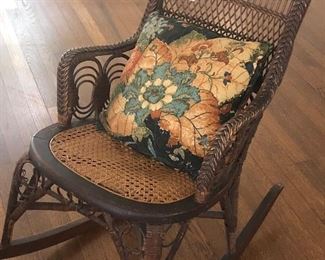 Antique wicker and cane rocking chair. $350