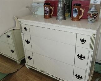 Dresser with mirror and collectible beer steins