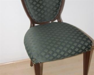 One of 8 dining chairs, two with arms.