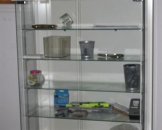 Table top glass shelves and doors curio.