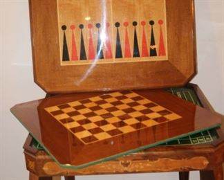 Italian games table with removable top to show under side with back gammon, chess, mah jong, and roulette.