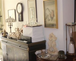 Statues, silver plate tea set, stemware.