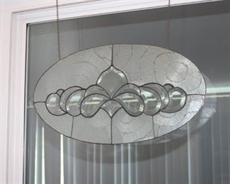 Beautiful oval shaped stain glass piece.