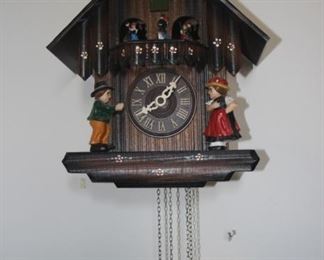 Cuckoo clock with weights.