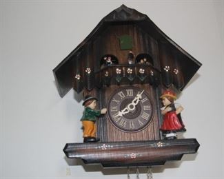 Cuckoo clock with weights.