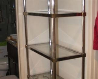 Chrome and brass with glass shelves.