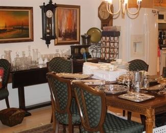 Dining room area. Lead crystal decanters, stemware. Silver plate tea set, bone china luncheon and tea set.