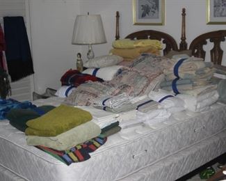 Queen size bed, linens, blankets and comforters.