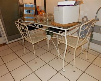 Wrought Iron Table w/glass top & 6 chairs (only 4 shown)