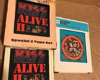 Two of the three KISS 8 track tapes for sale are sleeved. the third is their Destroyer tape w/ no sleeve