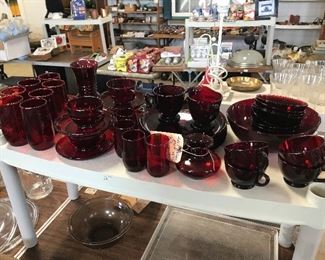 numerous ruby red dishware