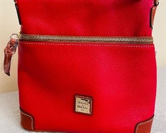 $100
Dooney & Bourke Red Crossbody
Never used has tags!& manufacture felt 
