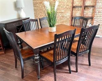 $450 Classic espresso dining table with six chairs. Table has hidden leaf extension. Table: 61w (without the leaf) 30h 42d Chair: 19.5w 40h 19d. Very good condition, normal wear, sturdy. 