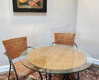 $200 Glass top bistro table with 2 chairs. Some wear visible on the natural fibers. You move!