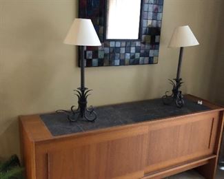 Teakwood buffet shown with buffet lamps and wall  mirror