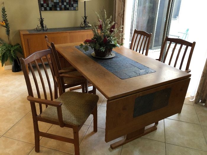 Teakwood table with slate insert.  There are 6 matching chairs
