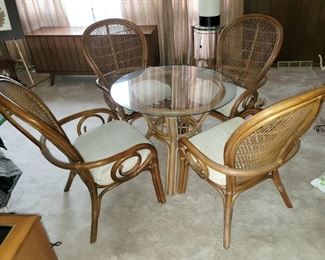 Rattan wicker patio chairs and 36" round table. 