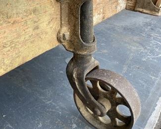 HERE'S ONE OF THE WHEELS FROM AN ORIGINAL RAILROAD BAGGAGE CART