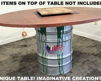 IMAGINATIVE TABLE USING A 50 GALLON DRUM. THERE'S ANOTHER DRUM LIKE THIS ONE.  THEY WERE CUSTOM DESIGNED FOR "ALT ENERGY LAB", WHICH IS WHAT'S WRITTEN IN THE COLORFUL INK IN THE MIDDLE.  ALSO SELLING IS A LARGE SIGN OF THE LOGO AND COMPANY NAME.
