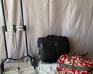 Bags and Baggage
Brighton nylon tote, Swiss Army carry on bag on wheels, baggage dolly