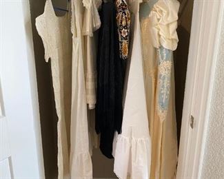 Vintage Wedding Gown and Other Clothing
Baby's christening gown with bonnet, woman's beaded cocktail dress (size small), beaded evening poncho, and a vintage wedding gown with long train and lace and has a petticoat slip,