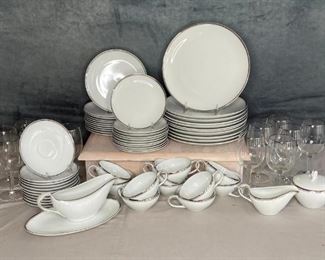 Japanese Set of Dishes and Glasses
Service for 12, dinner plate, salad plate, dessert plates and saucers, 12 cups, 12 matching drinking goblets, dessert and sherbet bowls, 2 serving bowls, TUKAGAWA, Arata pattern, hand painted silver colored trim, no evident chips or cracks