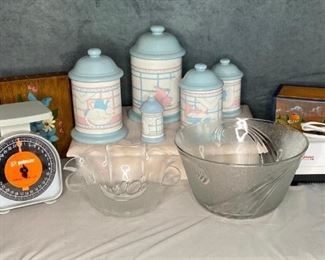 Country Cannisters and More
5 cannisters (chip in large cannister), kitchen scale, electric knife sharpener by Chef's Choice, 2 large glass bowls, painted wood knife rack, painted wood recipe box