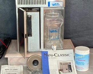 Pure Water, Inc.
Water purifier Mini Classic portable distiller, booklets, missing plastic lid can easily be ordered