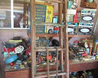Wooden extension ladder and many hand tools