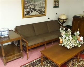 Basement  area mid century modern  sofa, floor stand globe 