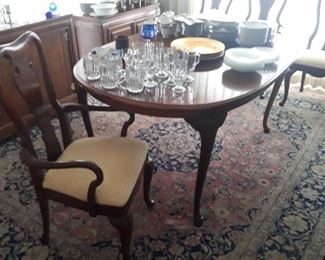 Queen Anne style oval dining table with chairs. And pair of table leaves.  And a server