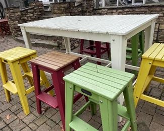 Tall white umbrella table with 6 colorful stools