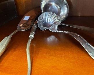 silver ladles, spoons, and forks