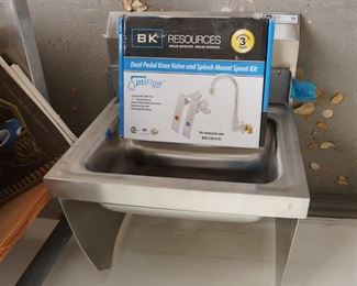 Commercial kitchen sink with fixtures