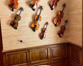 Wall of violins from 1/10 to full size—German, Suzuki, etc