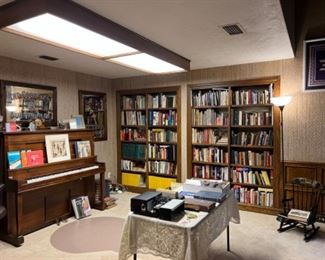 Office/study. Lots of books and another piano, three hanging vintage Advertising mirrors from Great Britain 