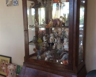 Vintage curio cabinet, inside cats, figurines