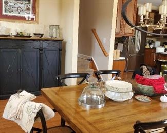 Dinningroom table that was almost 20k new selling at less than 10% of the purchase price with extra leaves and 10 chairs