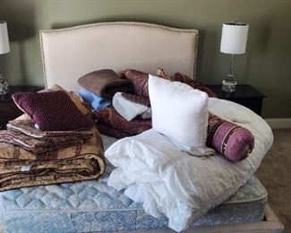 Queen nailhead riveted headbord with matching rails and footboard all upholstered with mattress pillows and bedding.. lamps pending*