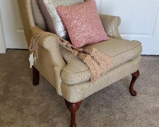 Wingback armchair upholstered with wooden legs