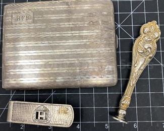 The H Lot: cigarette case, sterling silver H seal stamp, hammered sterling silver clip.