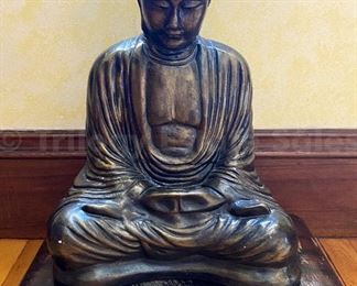 painted cast stone Buddha