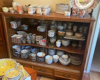 Oak sliding door cabinet and tons of asian pottery and china